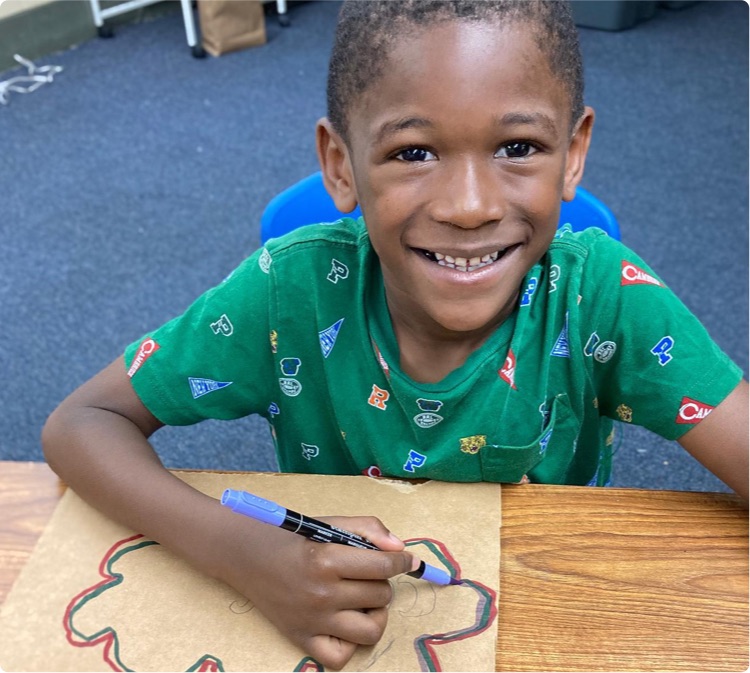 a student making art in a classroom